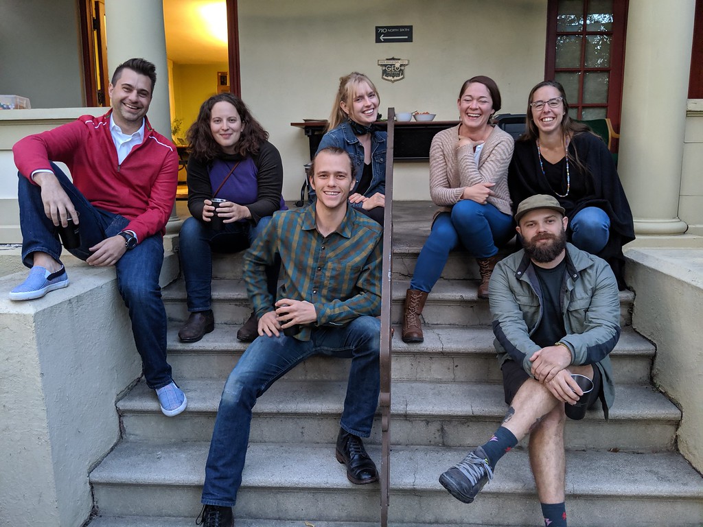 ELIE members sitting on the steps outside the ICL office.