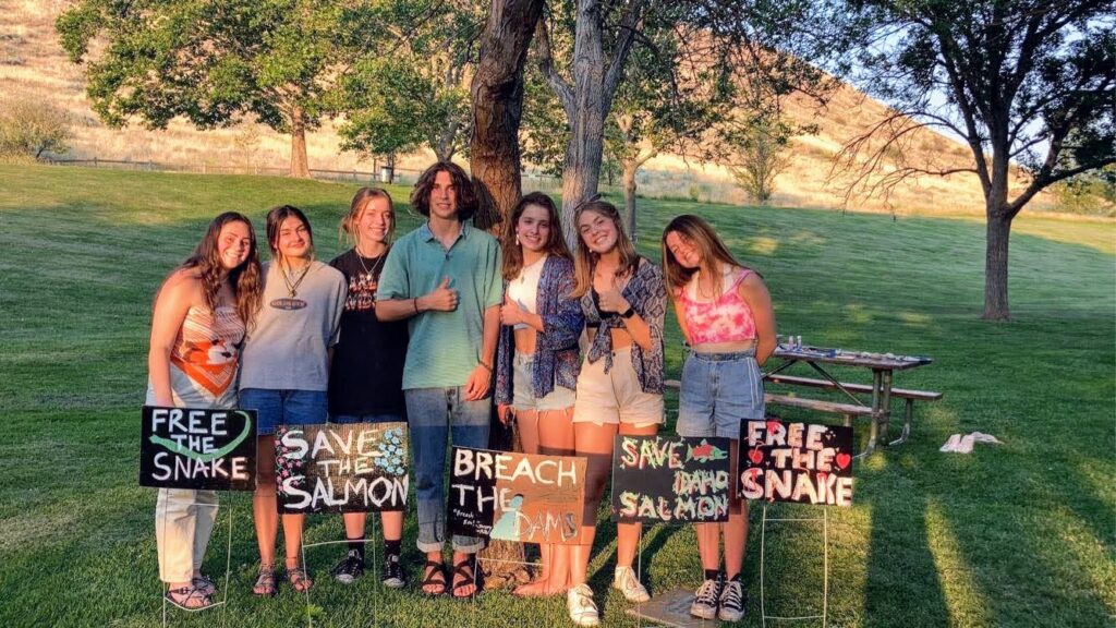 Youth Salmon Protectors paint yard signs supporting dam breaching in Camel's Back Park in Boise, ID